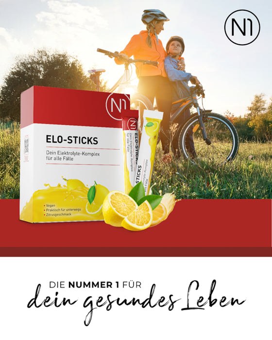 N1 Elo-Sticks Verpackung vor einem aktiven Mutter-Kind-Duo mit Fahrrädern im Sonnenuntergang.